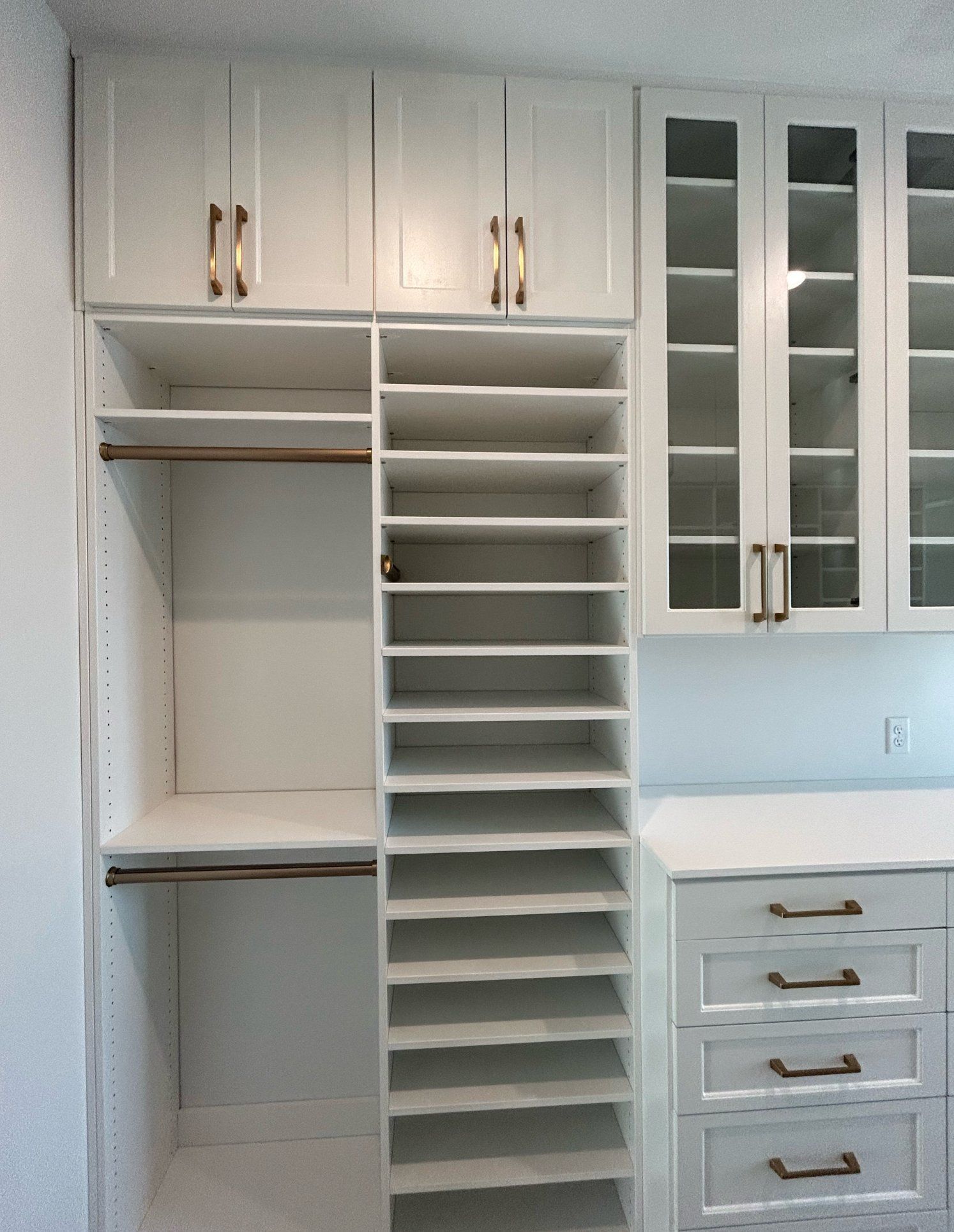 A closet with lots of shelves and drawers