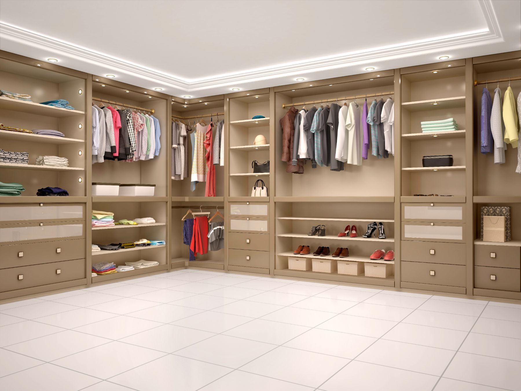 A walk in closet filled with lots of clothes and shoes.