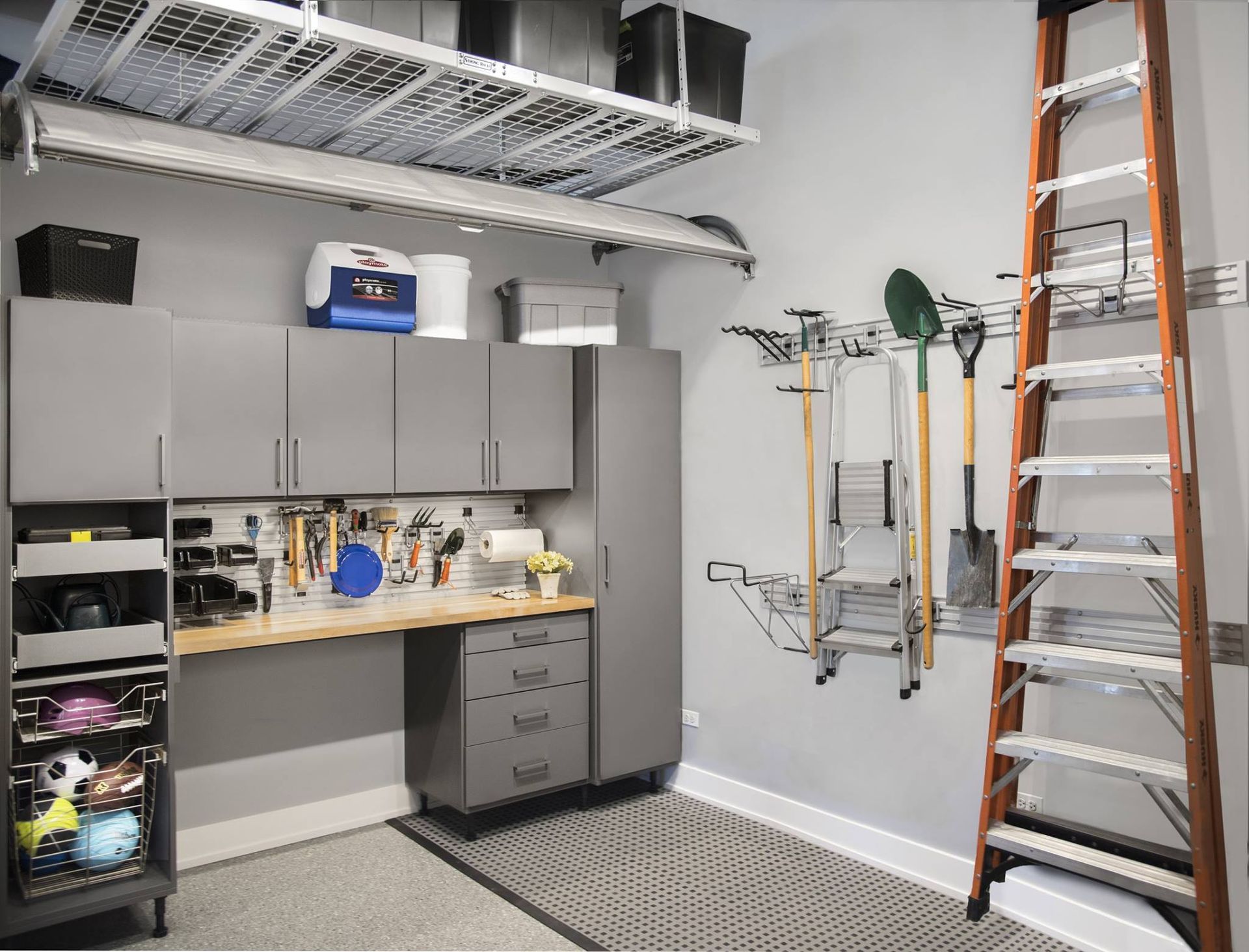 A garage with a ladder and lots of storage space