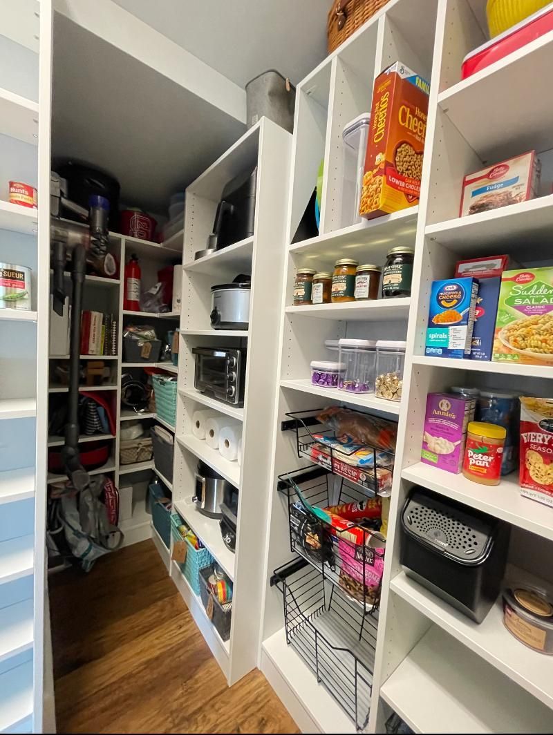 A pantry filled with lots of food and shelves.