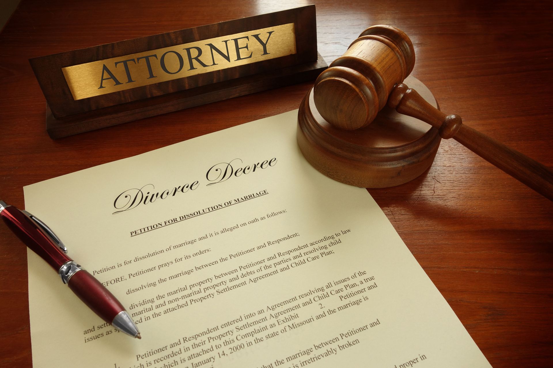 Divorce decree document with gavel, pen, and 