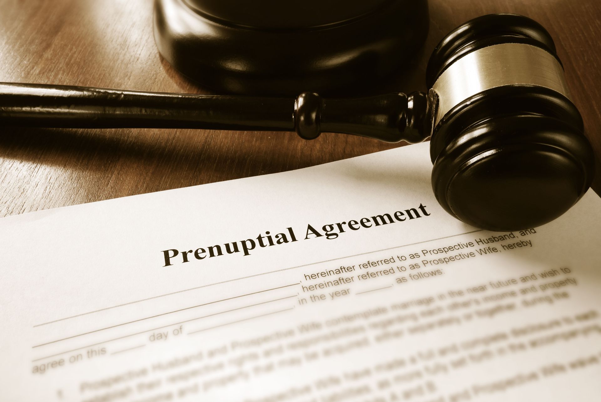 Prenuptial agreement document with gavel, possibly in an office setting.