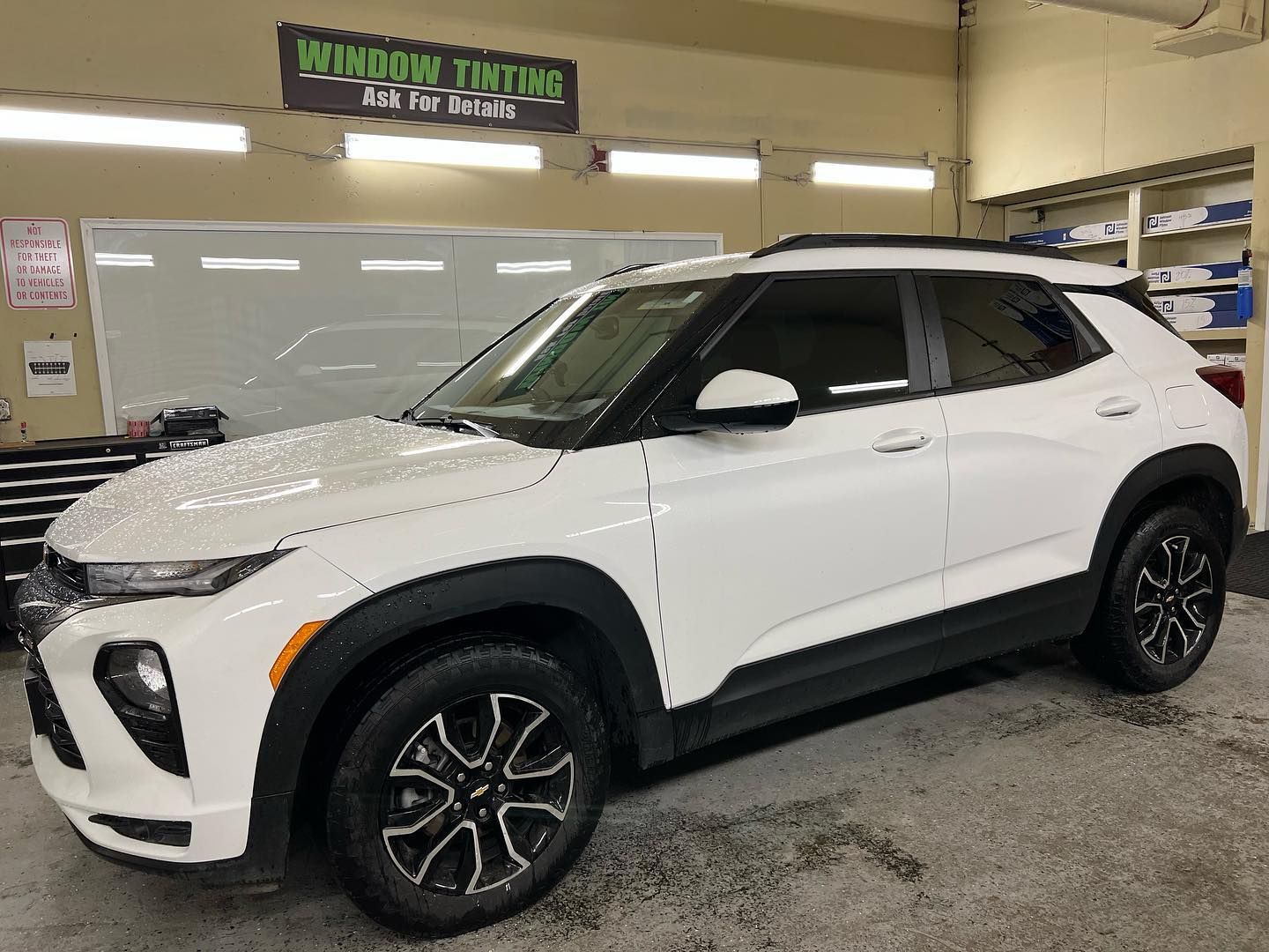 a white chevrolet trailblazer with window tinting