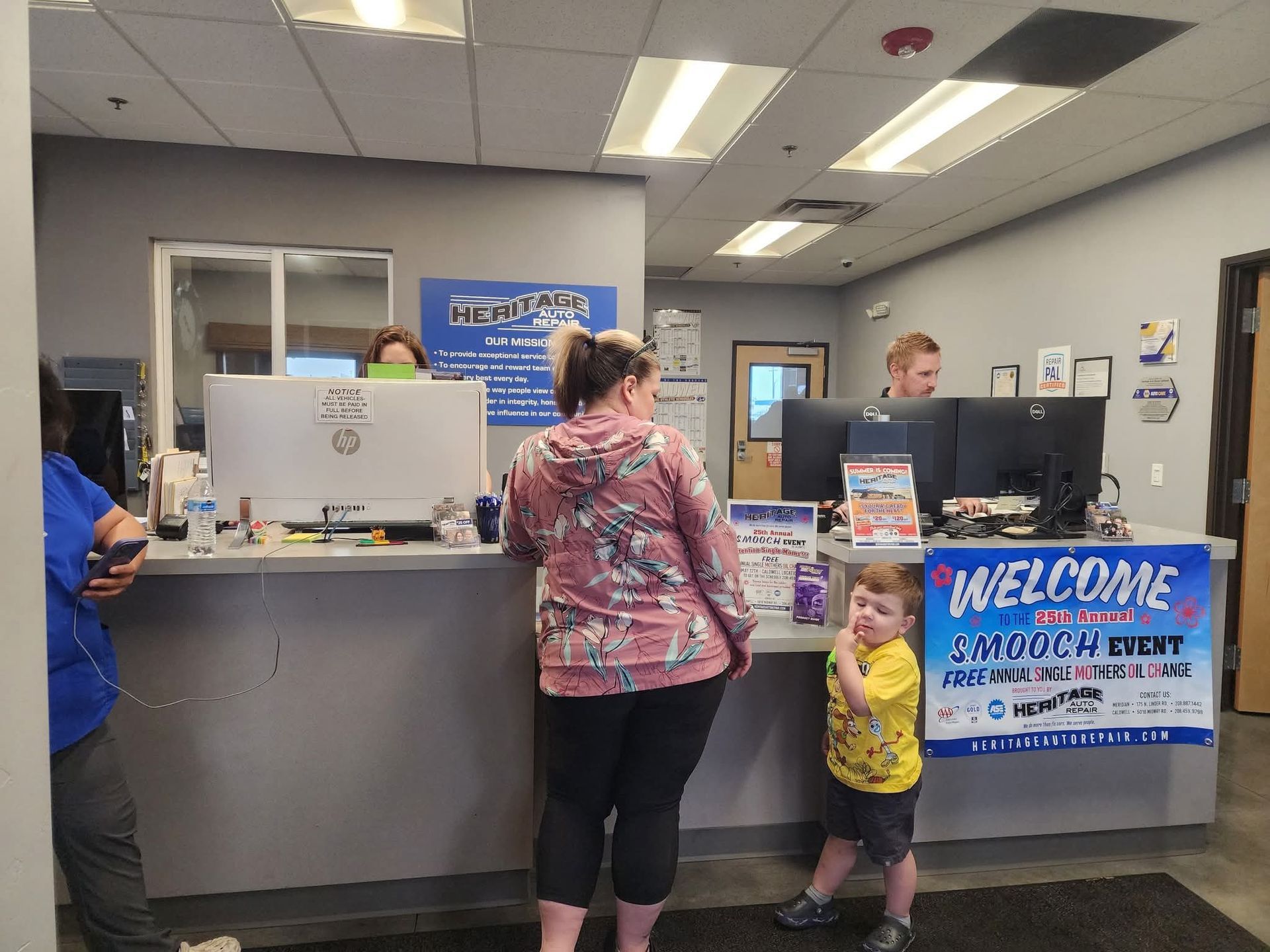 Customer service desk with staff and visitors.