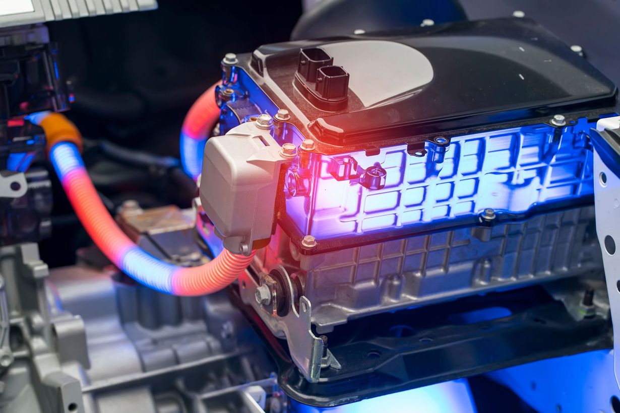 Close-up of a glowing blue-and-red computer cooling system with tubes and a metal housing