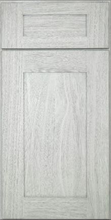 A close up of a white wooden cabinet door.