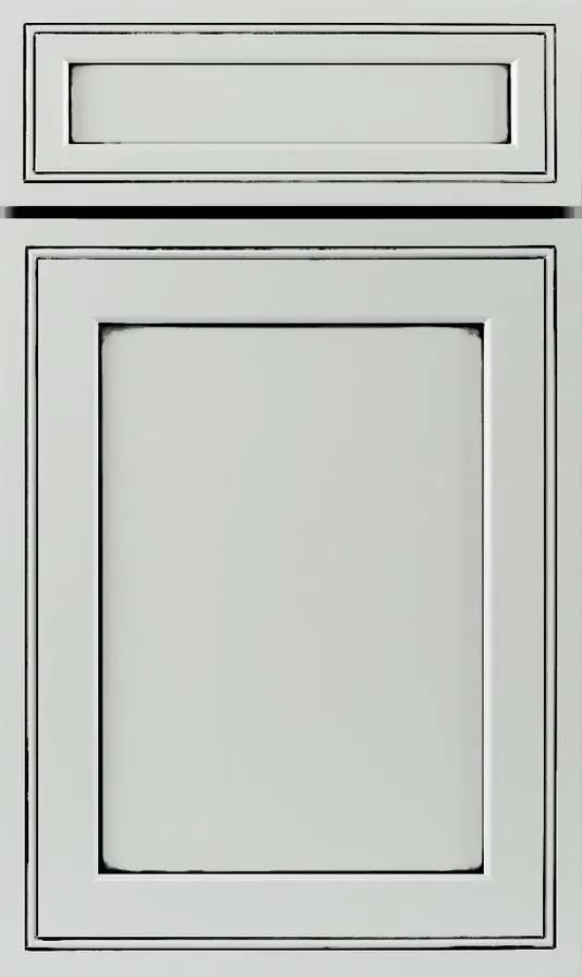 A close up of a white cabinet door with a black frame.