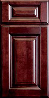 A close up of a wooden cabinet door with a drawer.