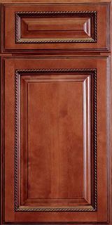 A close up of a wooden cabinet door with a gold trim.