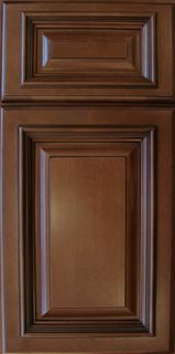 A close up of a brown wooden cabinet door.
