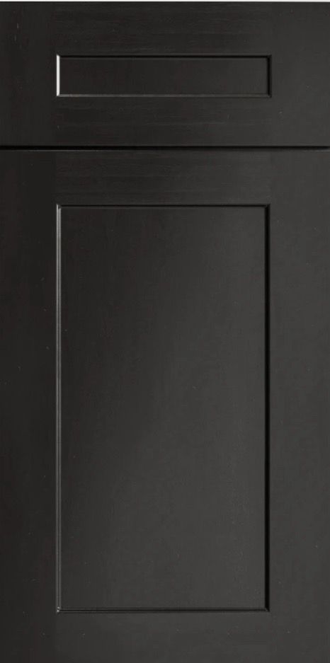 A close up of a black cabinet door on a white background.