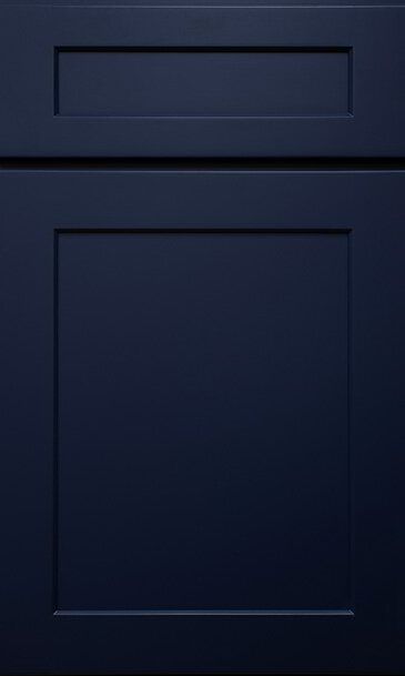 A close up of a dark blue cabinet door.