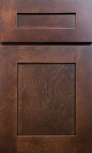 A close up of a brown wooden cabinet door.