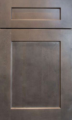 A close up of a wooden cabinet door with a square frame.