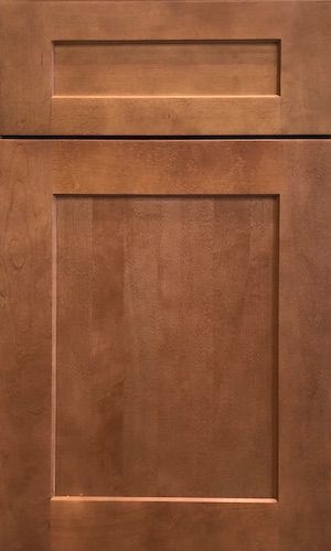 A close up of a brown wooden cabinet door.