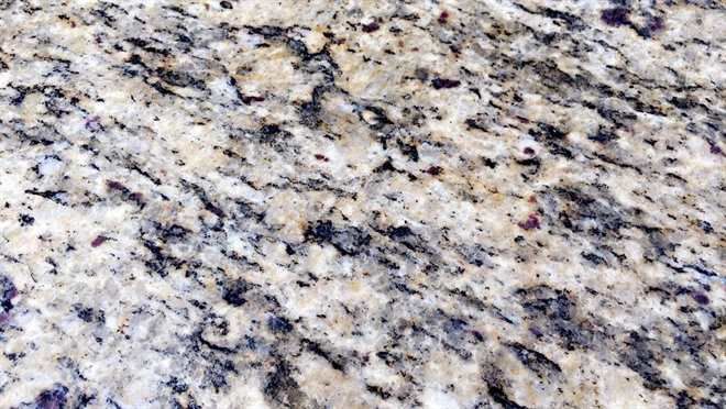 It is a close up of a granite counter top.
