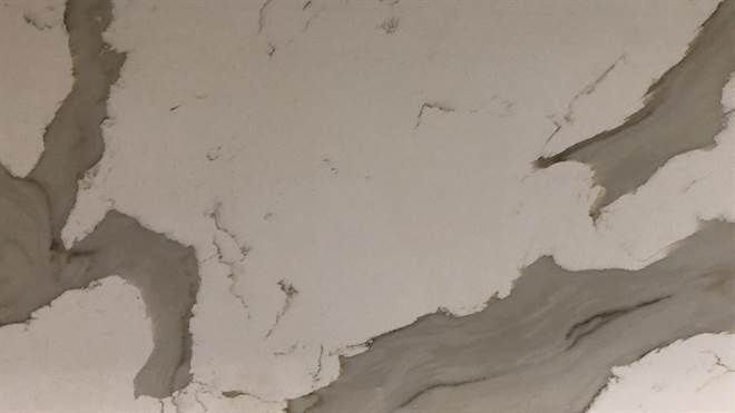 A close up of a white and gray marble texture.