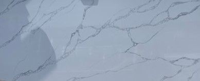 A close up of a white marble counter top.