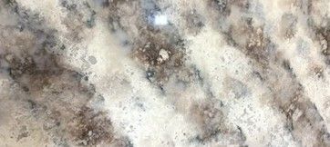 A close up of a counter top with a marble texture.