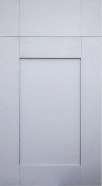 A close up of a white cabinet door with a square hole in the middle.