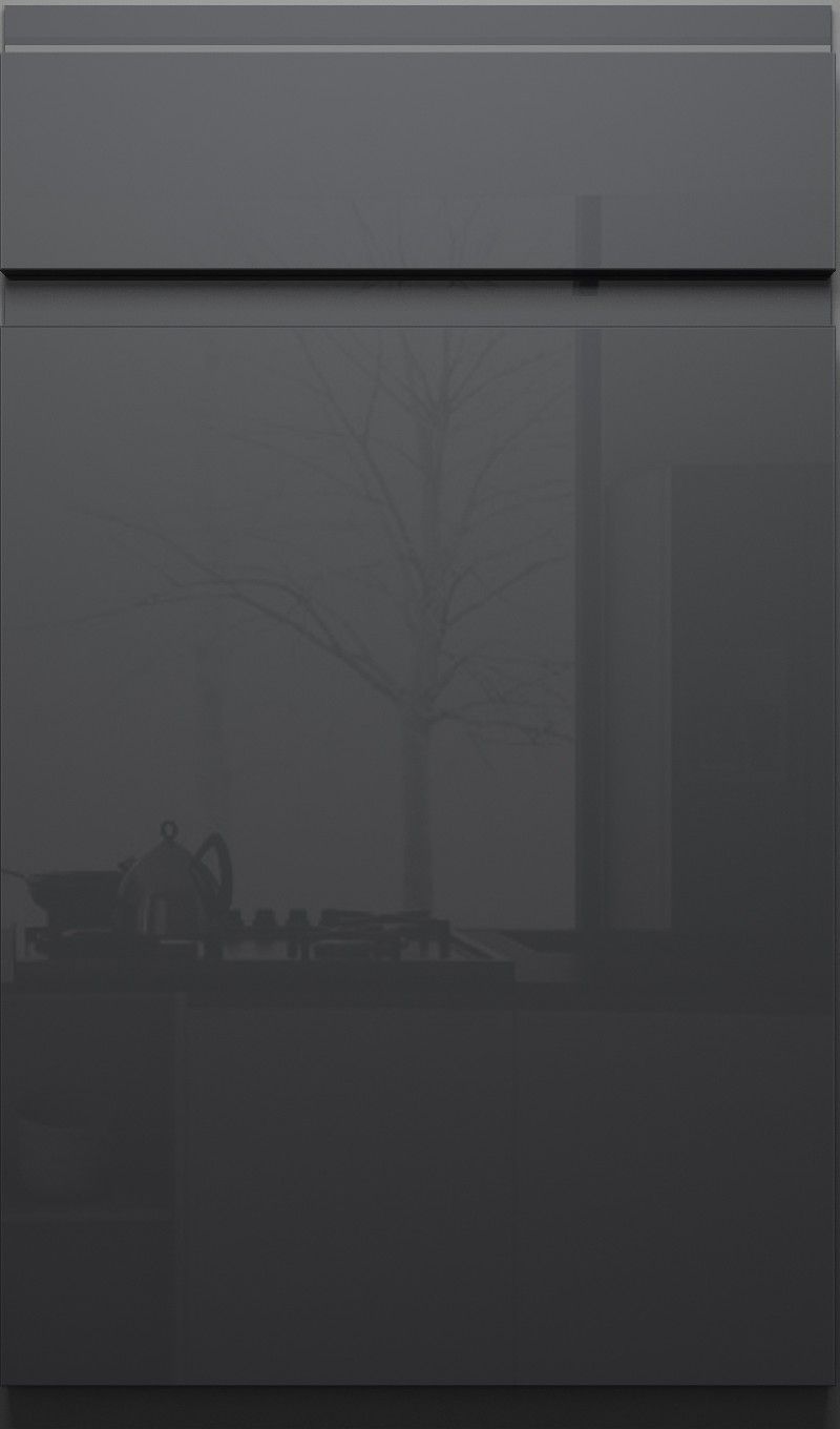 A close up of a black door with a tree in the background.