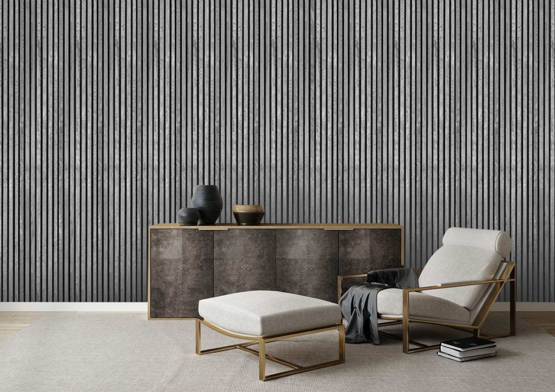 A living room with a chair and ottoman in front of a striped wall.