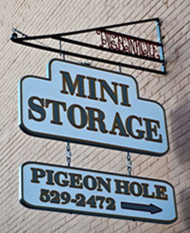 A sign for mini storage pigeon hole 529-2472