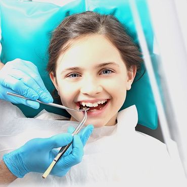 Smiling child during dental procedure