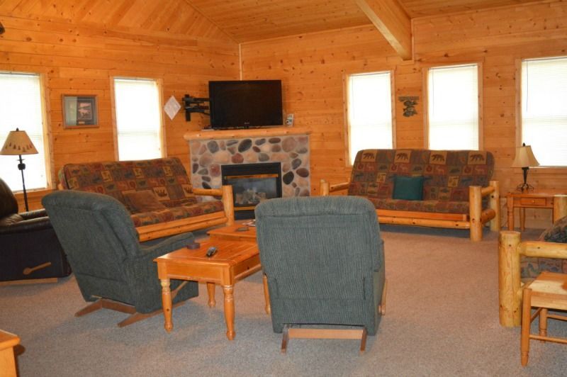 a living room filled with furniture and a fireplace