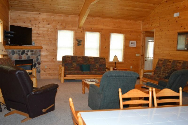 a living room filled with furniture and a television