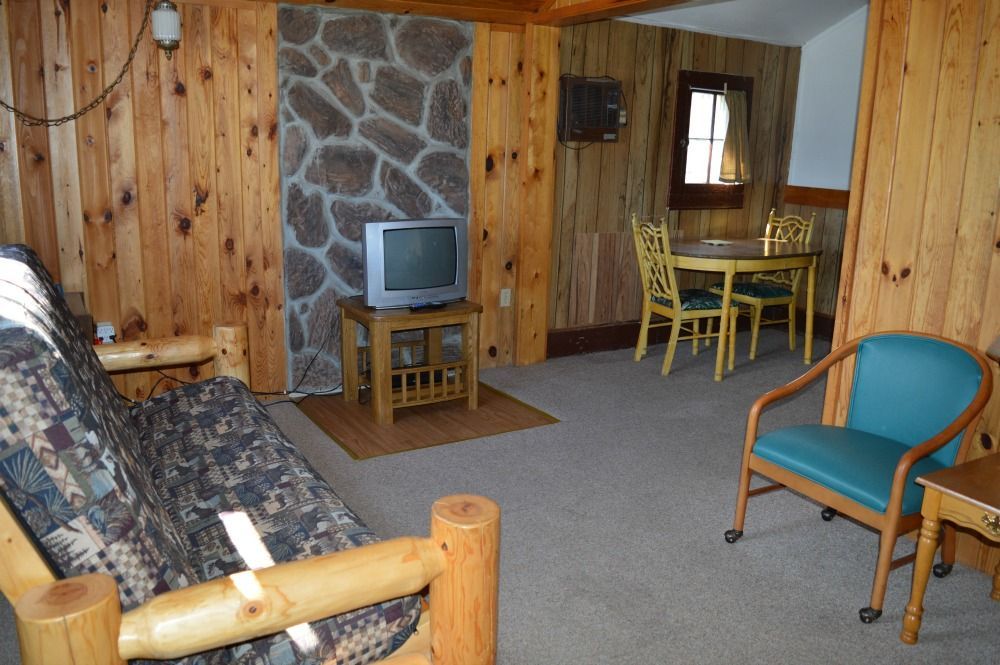 a living room with a futon and a television