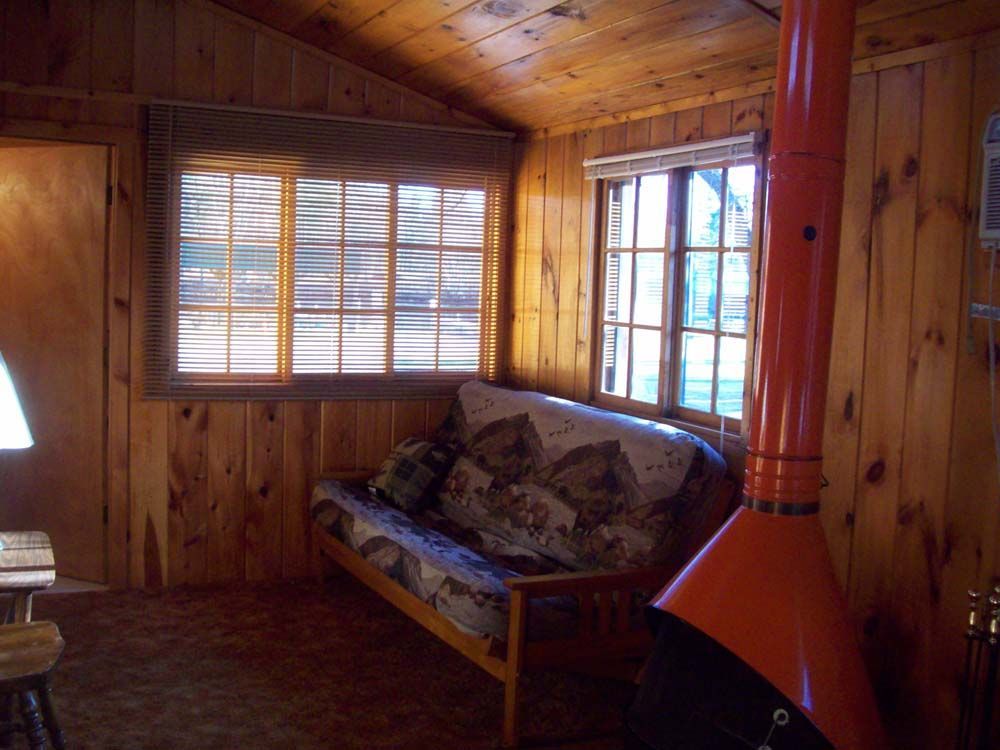 a living room with a couch and a fireplace