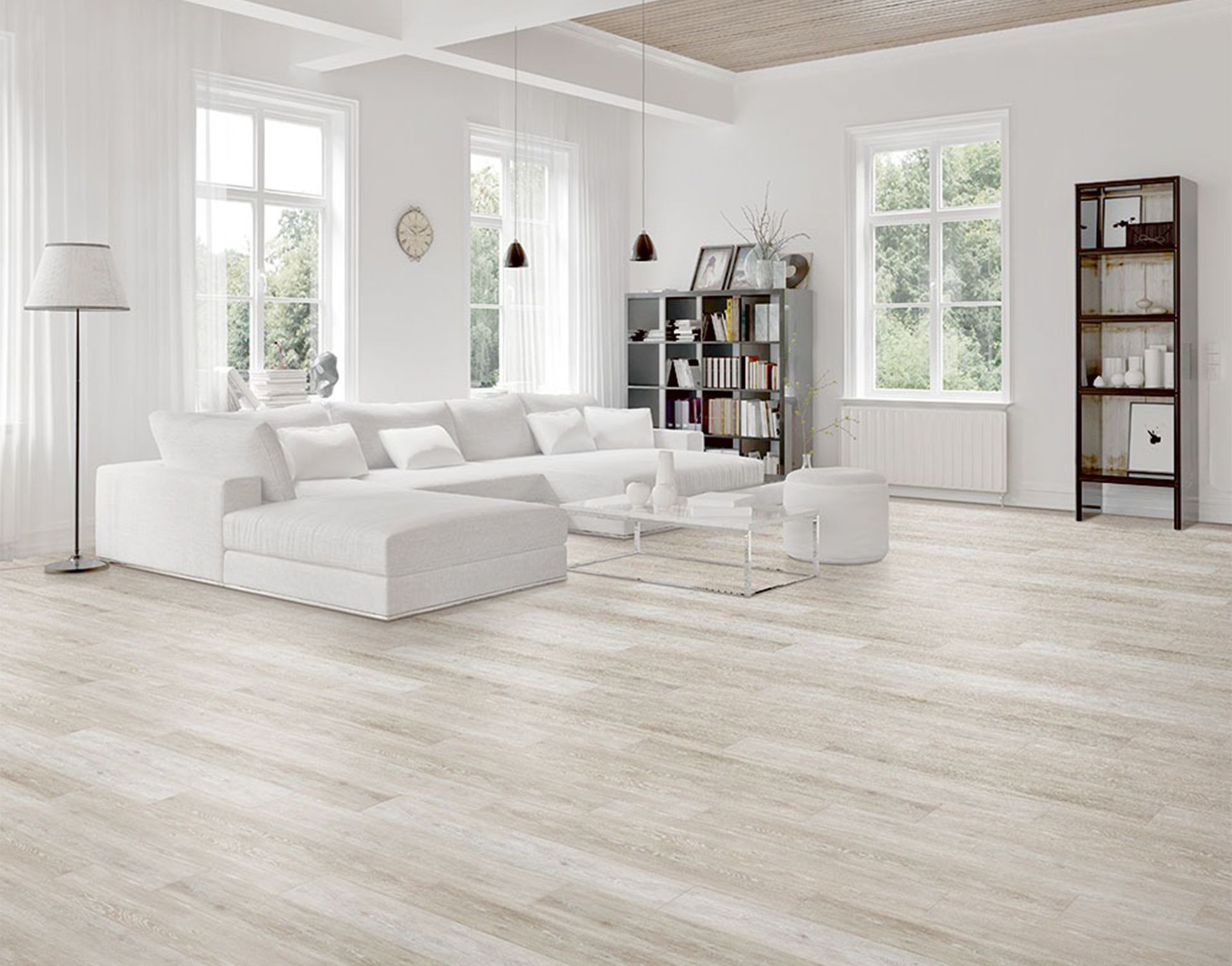 A living room with a couch, chairs, and a bookshelf.