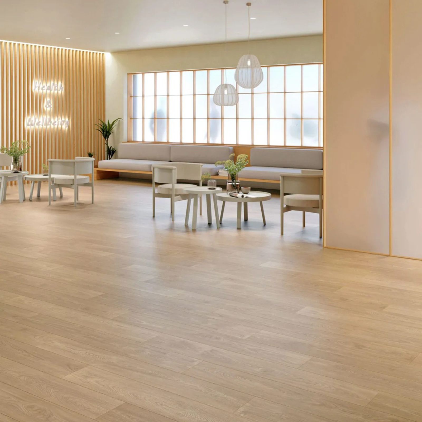 A living room with a wooden floor, chairs, tables, and a couch.