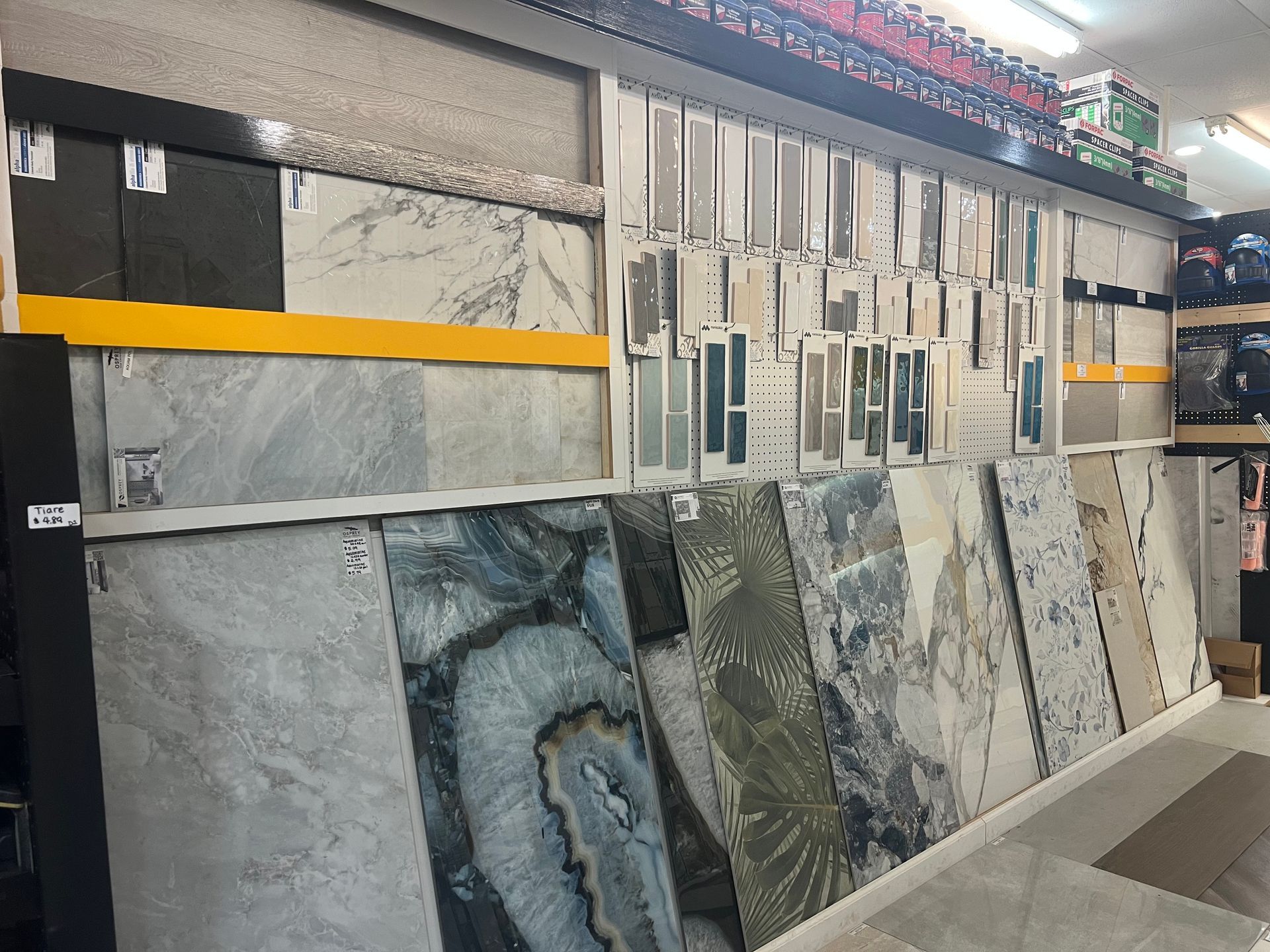 There are many different types of tiles on display in this store.