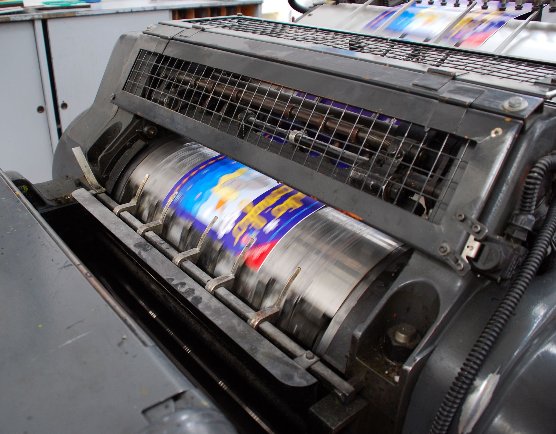 Offset printing machine printing colorful labels.