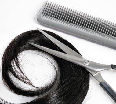 Shiny hair with hair cutting shears and comb
