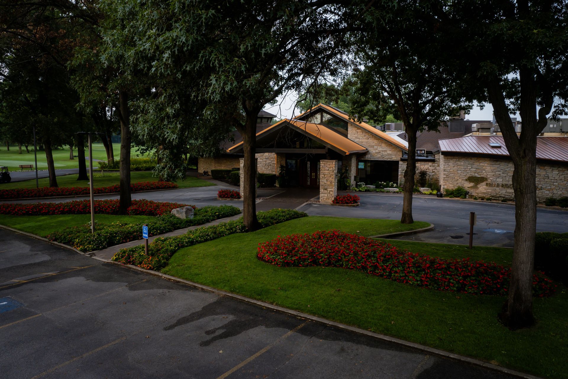 A large building with a parking lot in front of it