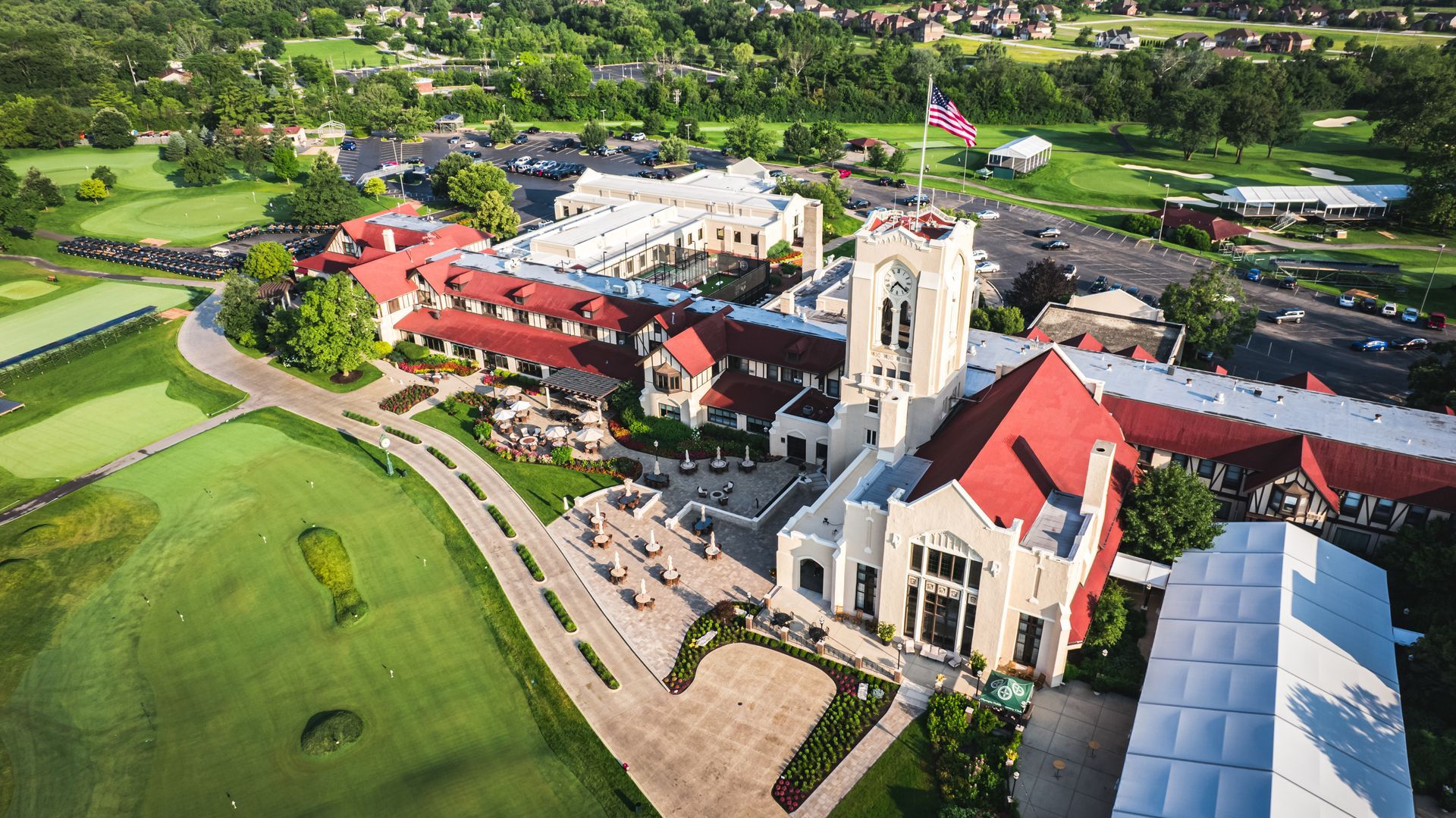 An aerial view of a church and a golf course.