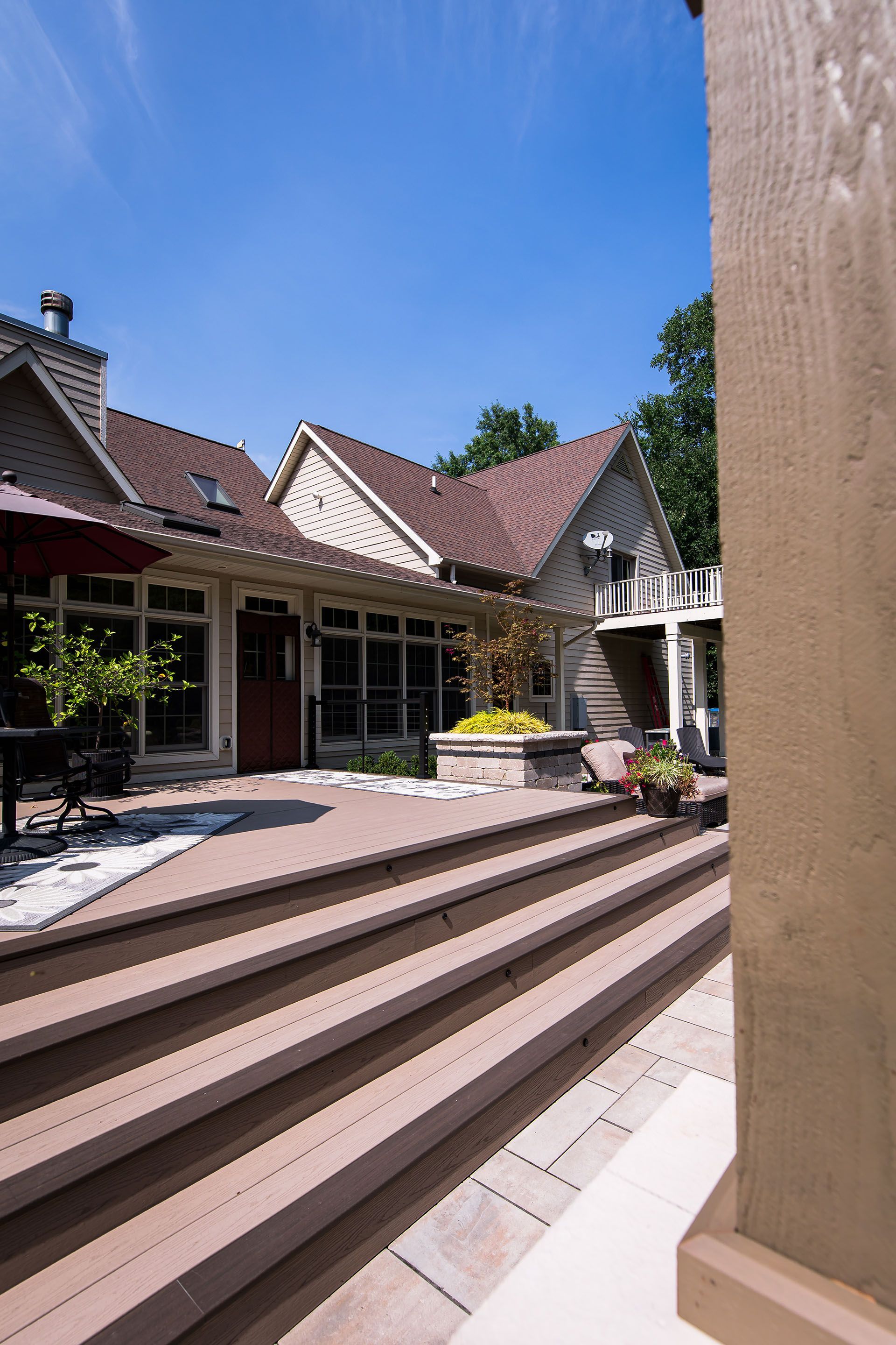 A large house with stairs leading up to it