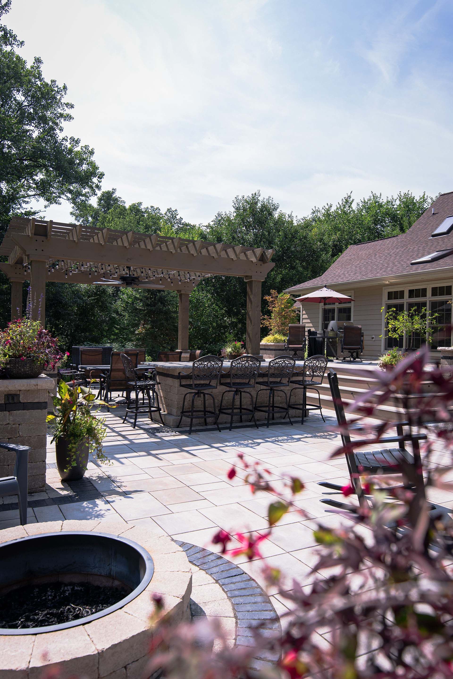 There is a fire pit in the middle of the backyard.