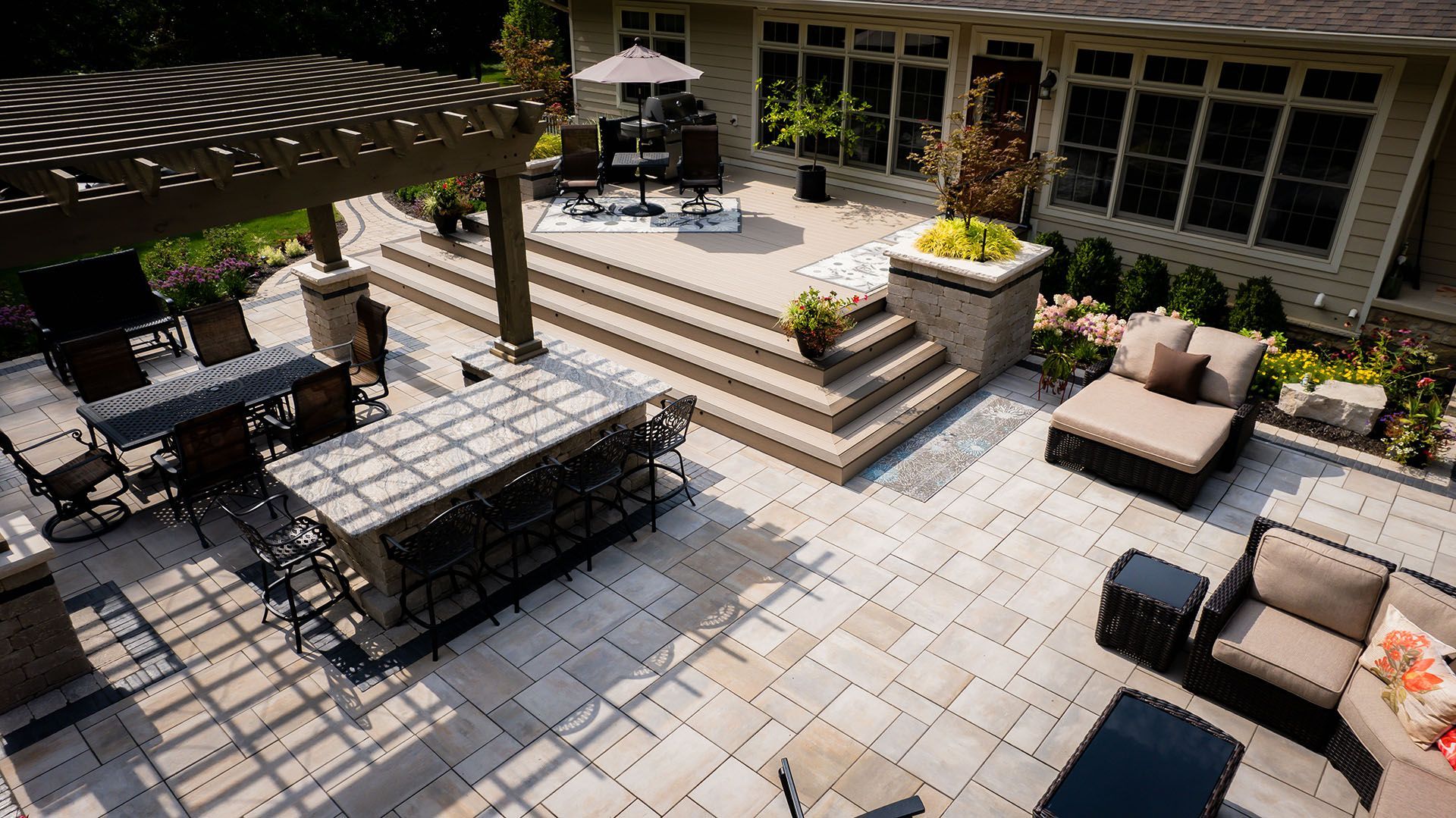 An aerial view of a large patio with a table and chairs.