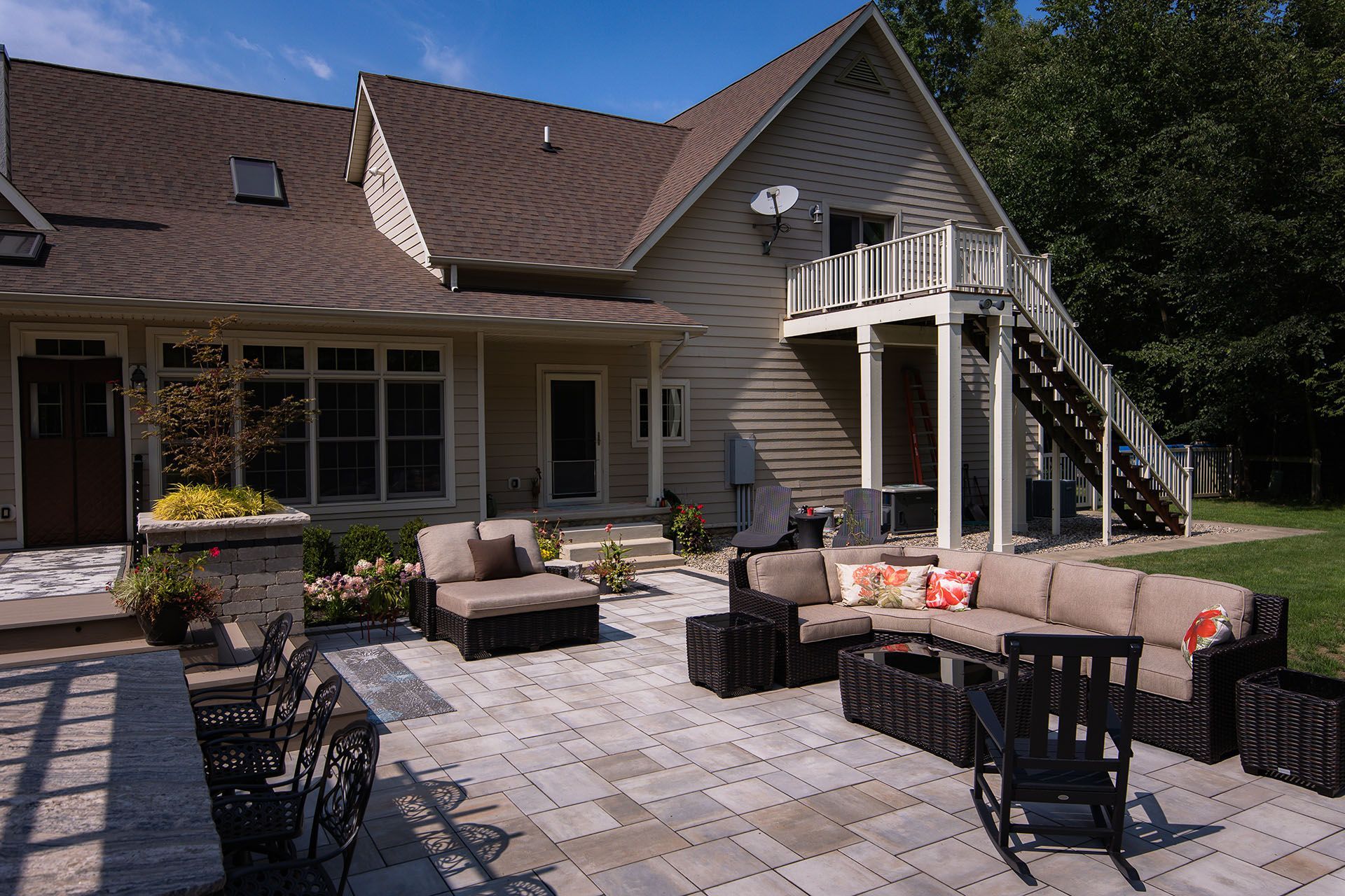 A large house with a patio in front of it