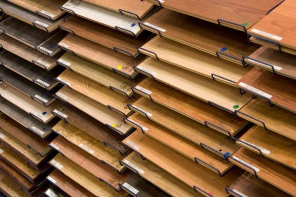 Stacked brown file folders in a shelving unit, viewed at an angle.