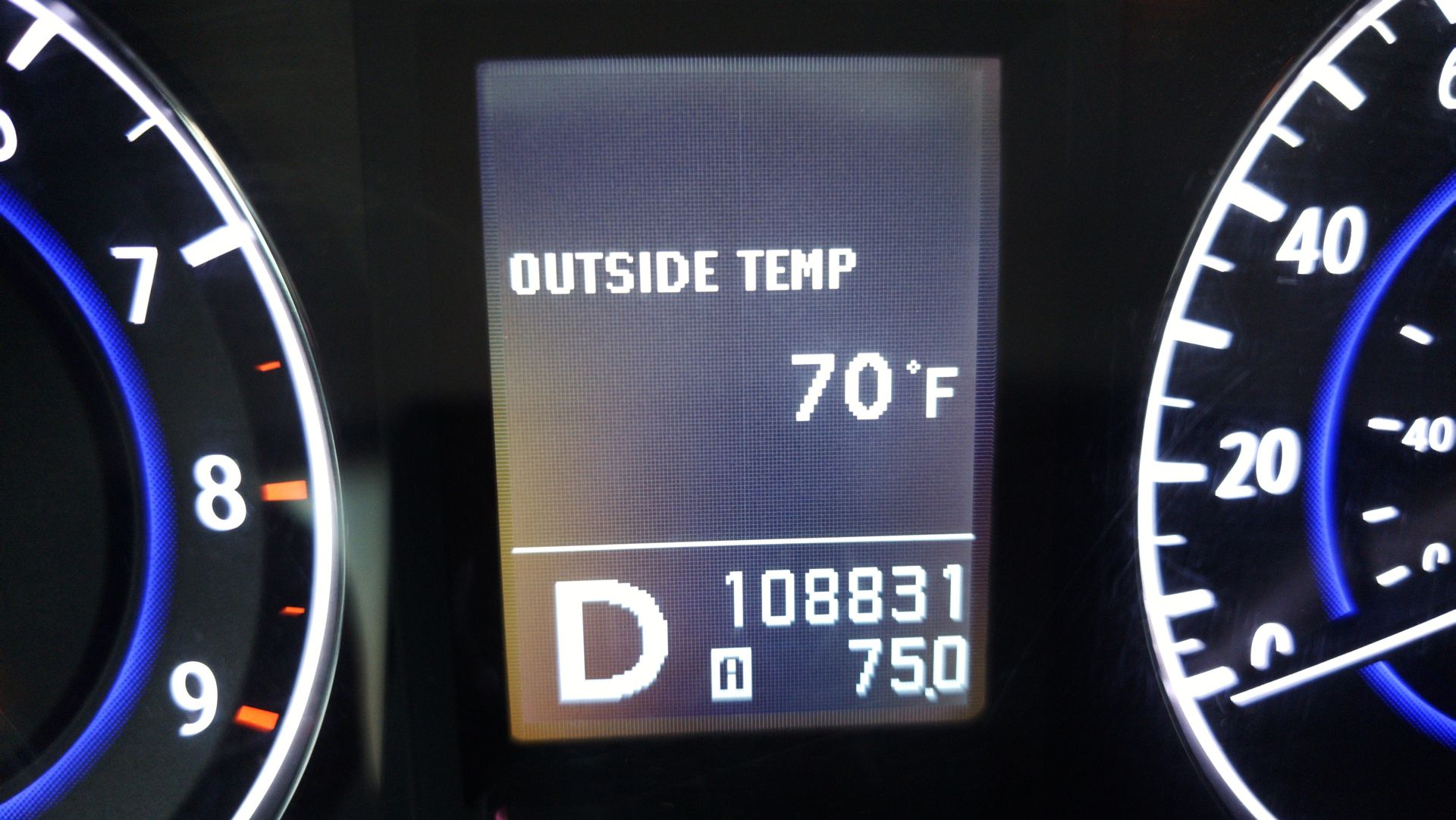 Dashboard display showing outside temperature of 70°F and odometer reading 108831.
