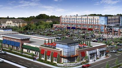 Rendering of a commercial shopping center with shops, parking, and a multi-story building in a suburban setting.