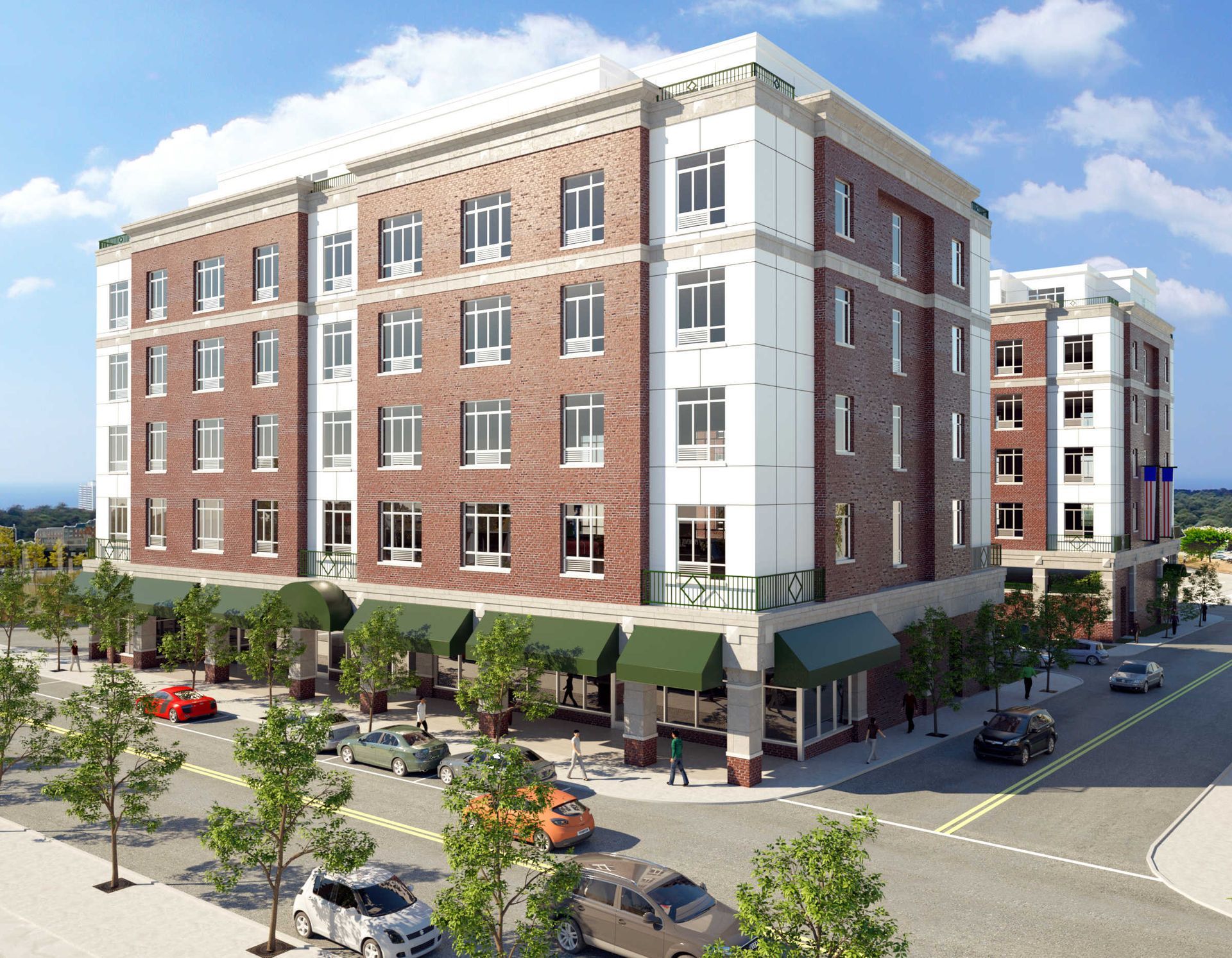 Multi-story brick and white building with awnings over storefronts on a city street. Cars and trees are visible.