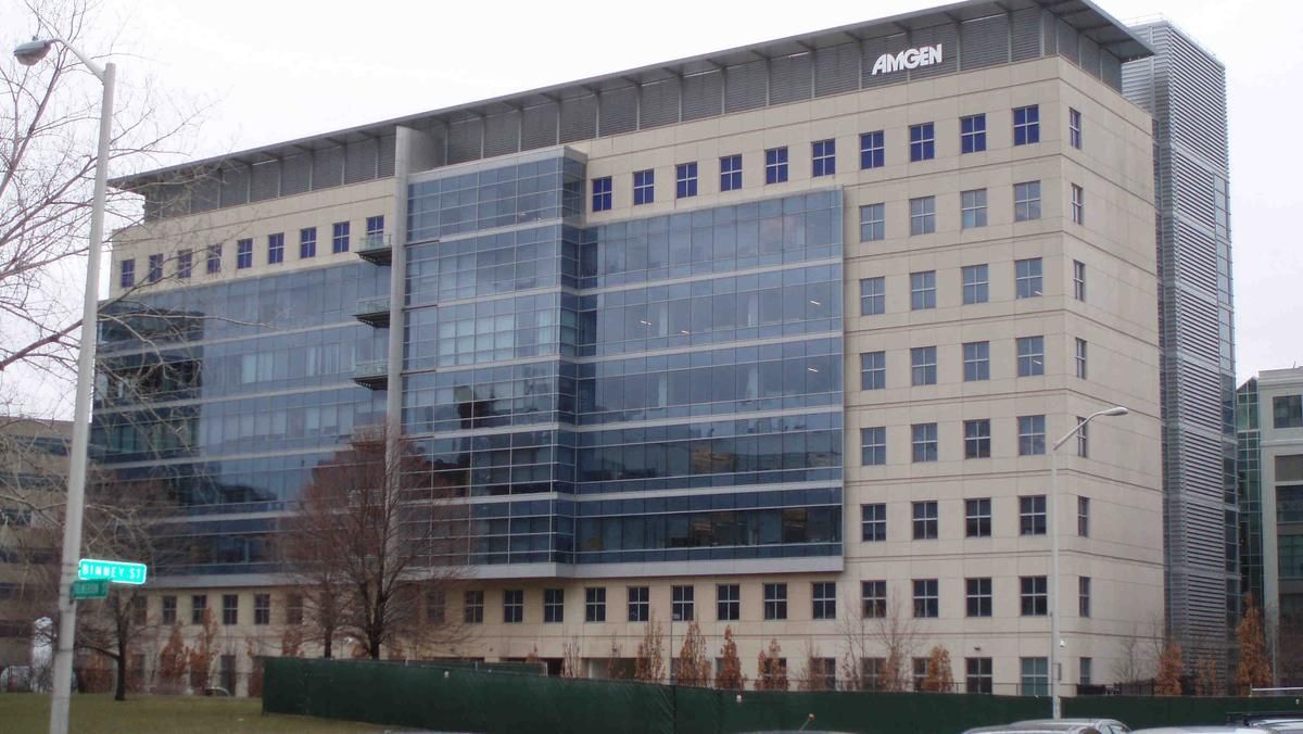 Office building with tan brick and glass facade,
