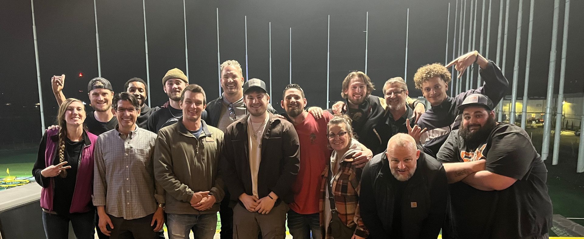 a group of people are posing for a picture together