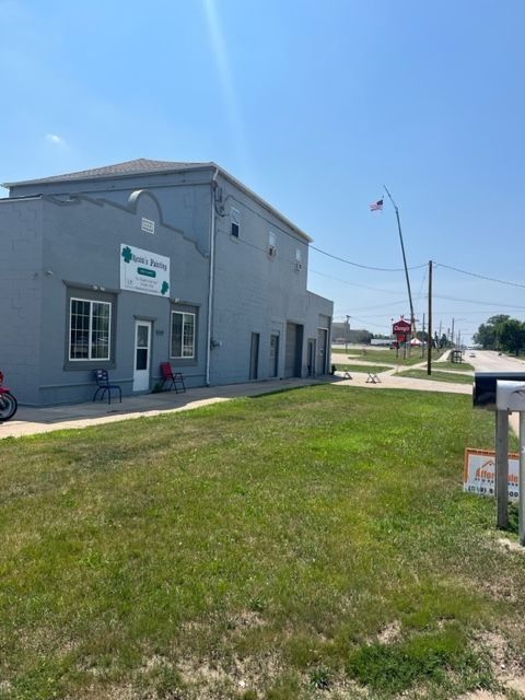 Gray building with a sign that says